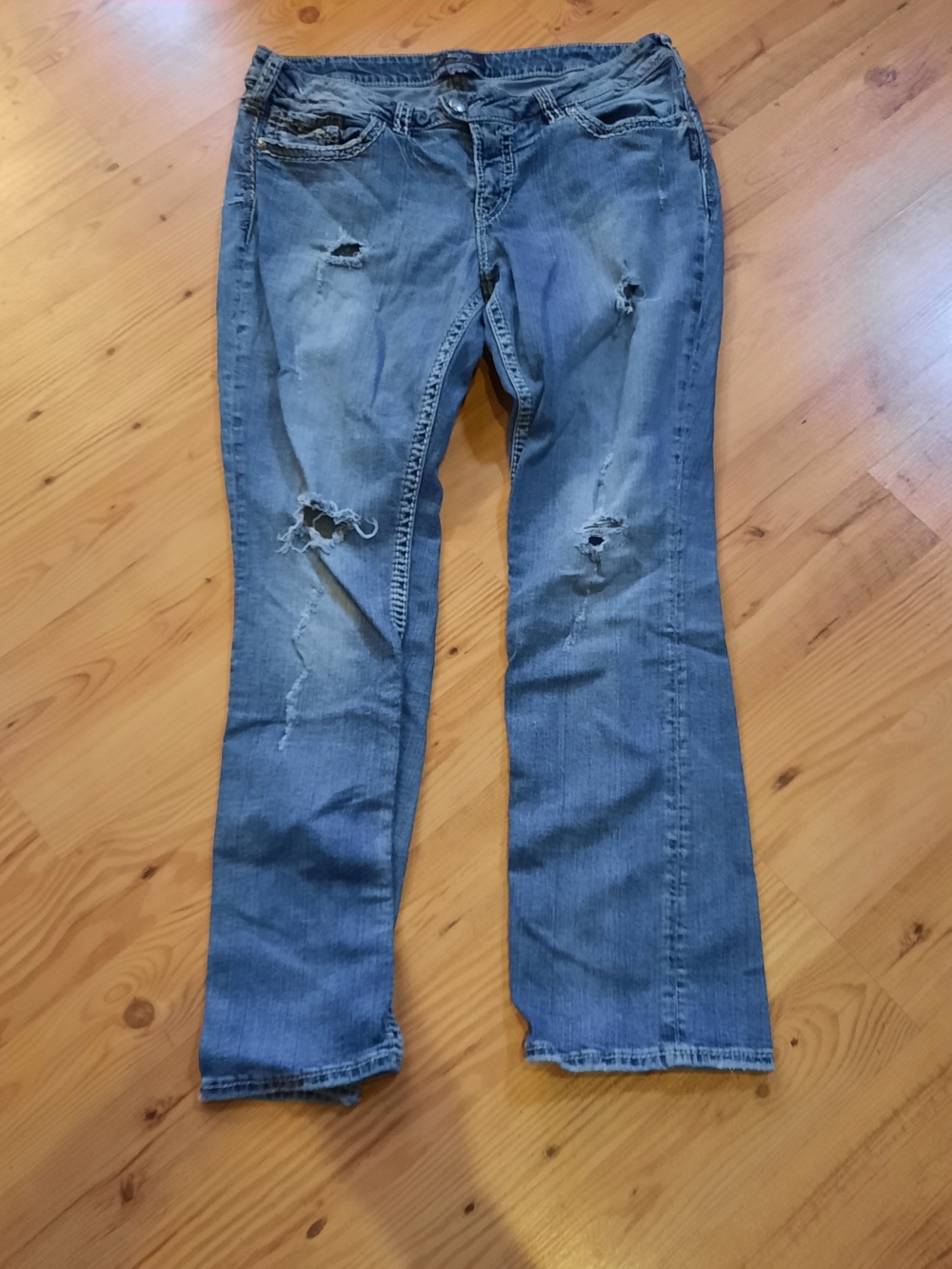 Silver Jeans Women's Distressed Light Blue Flare Jeans